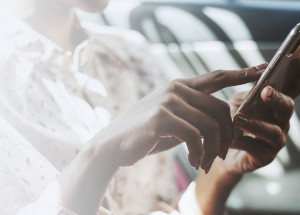 Woman using a phone in a car