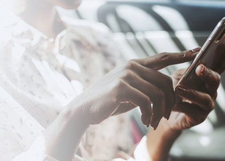 Woman using a phone in a car